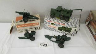A boxed Dinky 661 recovery tracker, a boxed Britains 25 pound gun and 2 cannons.