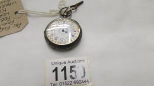 A silver engine turned fob watch, in working order and with key.