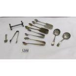 A mixed lot including sugar tongs, sifter spoons etc.