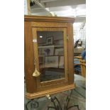 An oak corner cupboard.