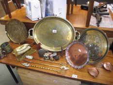 A mixed lot of brass ware including trays, toasting forks, coin trays, crumb tray etc.