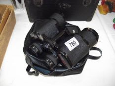 A cased pair of Tasco 16 x 50 313 binoculars.