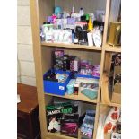 3 shelves of cosmetics and toiletries.