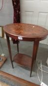 An oval inlaid occasional table.