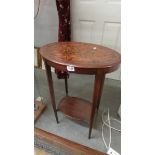 An oval inlaid occasional table.