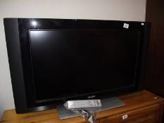 A Phillips flat screen tv with remote