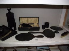 A quantity of mid 20th century ebony dressing table set and other items.