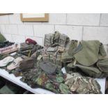 A large selection of military clothing, rucksacks, hats etc.