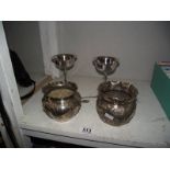 A pair of silver plate planters, 2 goblets, a mustard pot and 2 spoons.