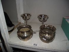 A pair of silver plate planters, 2 goblets, a mustard pot and 2 spoons.