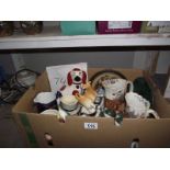 A box of pottery including character jugs, Staffordshire dog etc.