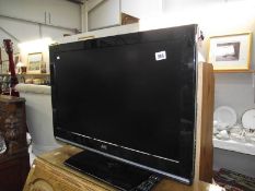 A JVC flat screen television.