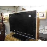 A JVC flat screen television.