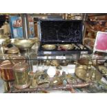 2 shelves of brass and copper including cased scales, French pigeon lamp, chamber candlestick etc.