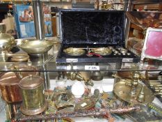 2 shelves of brass and copper including cased scales, French pigeon lamp, chamber candlestick etc.