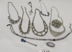 A collection of vintage necklaces and brooches.