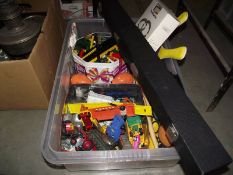 A box containing diecast cars including Corgi, lesney, and a tambourine, maracas, drumsticks etc.