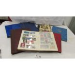 7 small albums of assorted stamps including German, Egyptian etc.