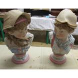 A pair of bust of young boy and girls, girls hat chipped.