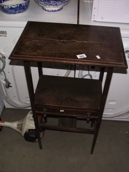 An Edwardian oak side table.