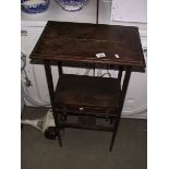 An Edwardian oak side table.