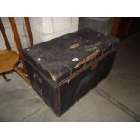 A vintage leather covered pine trunk.