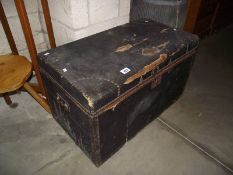 A vintage leather covered pine trunk.