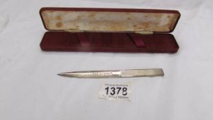 A silver letter opener, W M Birmingham.