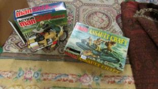 A boxed Palitoy Action Man police motorcycle and assault craft.