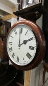 A circular mahogany wall clock.