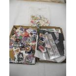 2 trays of assorted postage stamps.