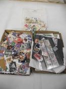2 trays of assorted postage stamps.