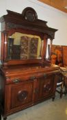 A mirror backed mahogany sideboard.