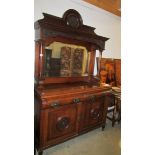 A mirror backed mahogany sideboard.