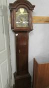 A small mahogany 8 day Grandfather clock.