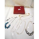 A mixed lot of costume jewellery necklaces.