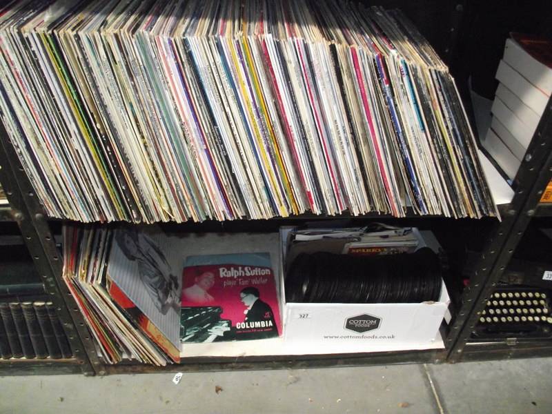 2 shelves of vinyl LP and 45 rpm records.