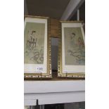 A pair of Chinese framed and glazed panels.