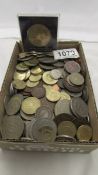 A mixed lot of assorted old UK and foreign coins.