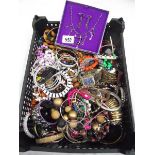 A crate of vintage costume jewellery.