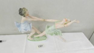 A Hutschenreuther figurine 'Dancing Sisters' by Lorenz. Made in Selb Germany, circa 1940's.