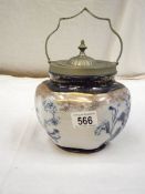 A blue and white Staffordshire pottery biscuit barrel with silver plate fittings.