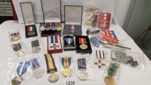 A good collection of medals and ribbons, Afghanistan etc., including some copies.