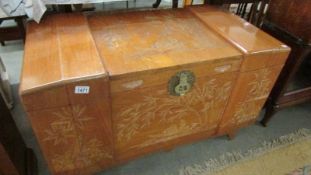 A large oriental carved box.