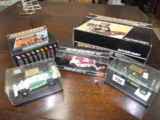 3 boxed Scalextric racing cars, autostart and pitstop kit.