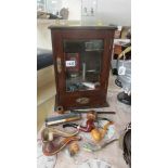 An oak smokers cabinet and contents.