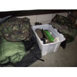 A selection of military clothing including sleeping bags, rucksacks, accessories etc.