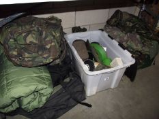 A selection of military clothing including sleeping bags, rucksacks, accessories etc.