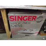 A boxed Singer magic press MP4