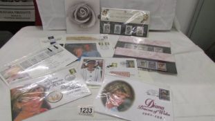 A collection of stamps and coin covers etc.